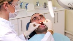 Dentist Flossing Teeth