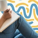 Person drinking tea and journaling