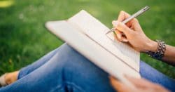 woman writing in a journal